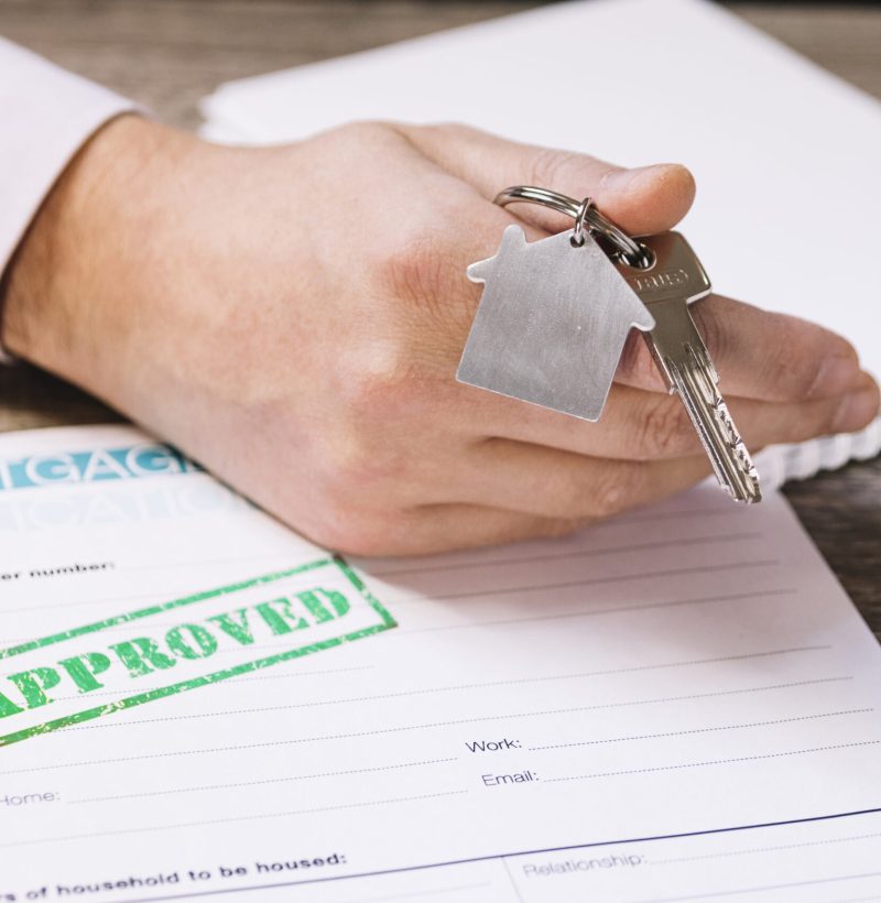 crop-man-giving-new-house-key