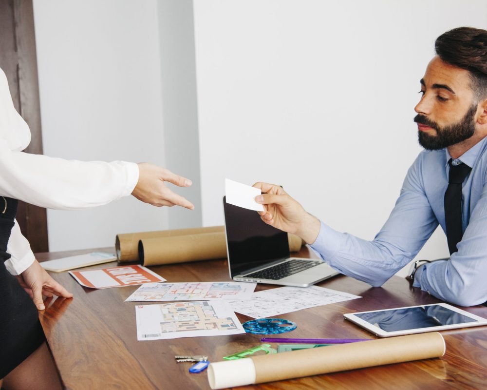 real-estate-agents-with-business-card